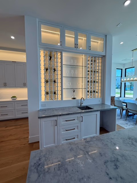 Glass-front wine room with backlit display